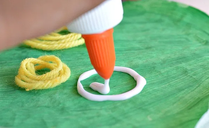 gluing yarn apples for apple crafts