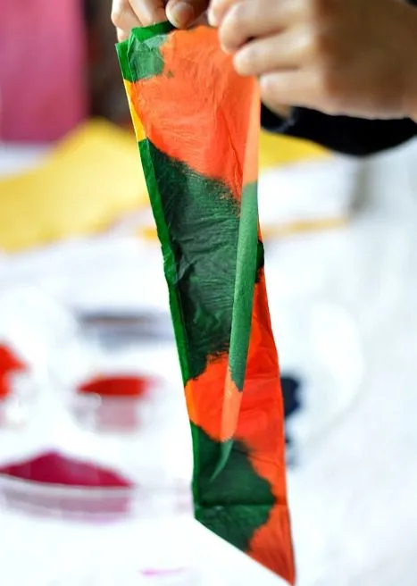 opening the folded tissue paper -colorful art