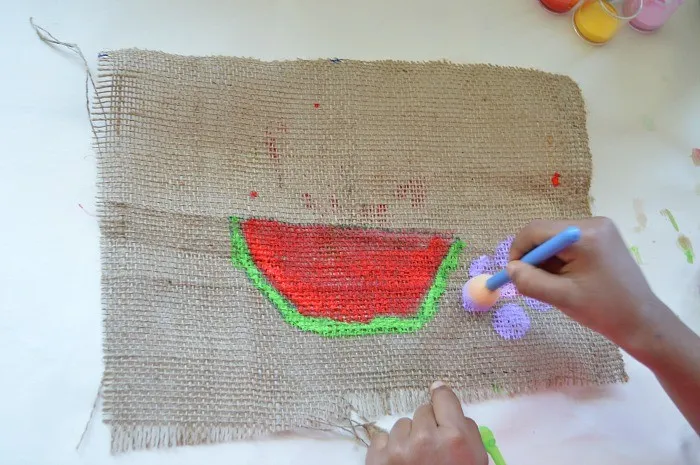 process of creating art on burlap