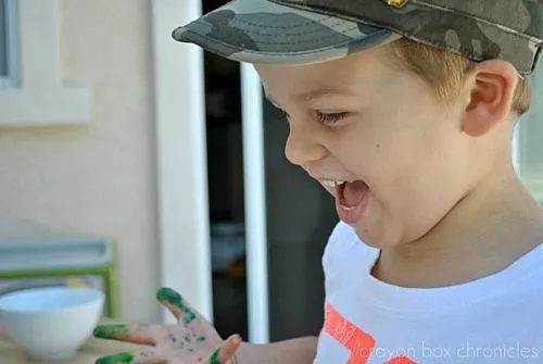 kid painting with metal