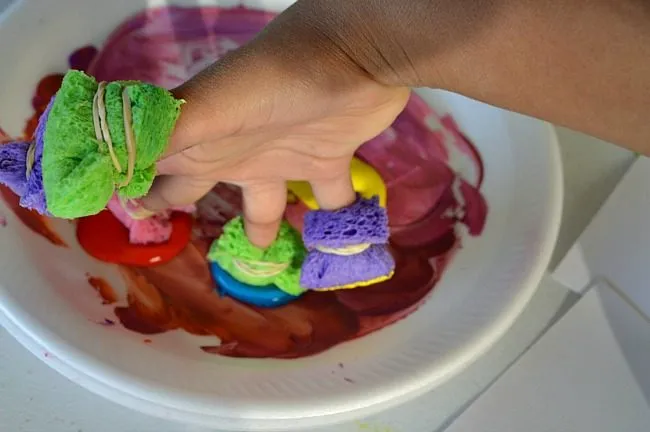 dipping sponge fingers in paint art projects