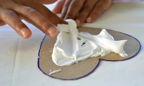 applying shaving cream for the art project