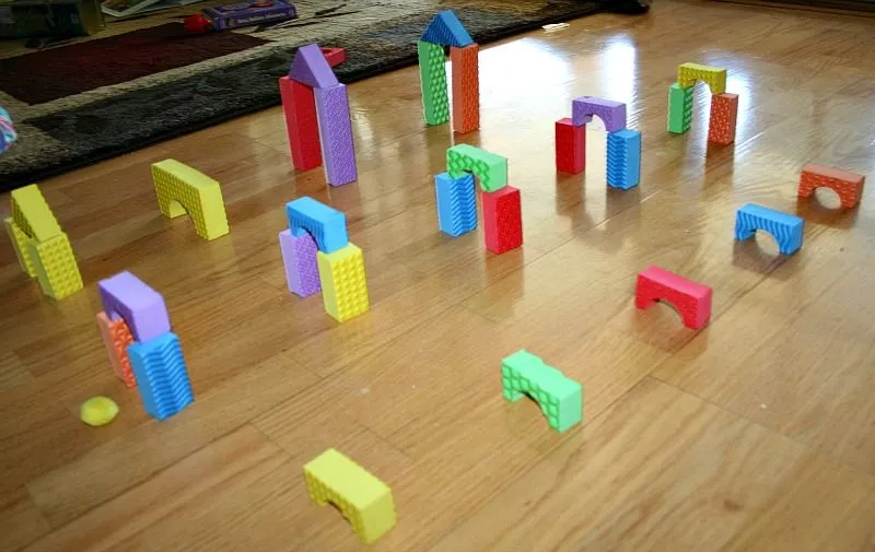 Blow Pom Poms Through Foam Buildings