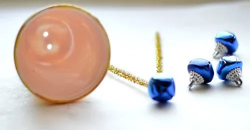 threading the bells to the cups- ornaments kids can make