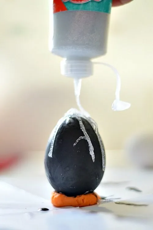 apply glitter glue on egg