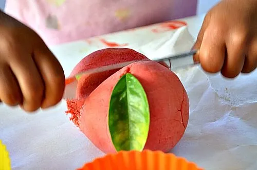 cutting apple play dough