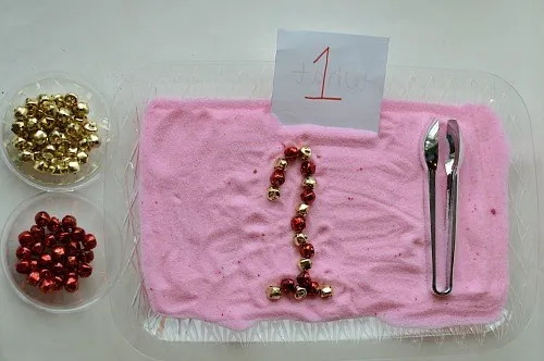 jingle bells fine motor tray with peppermint salt