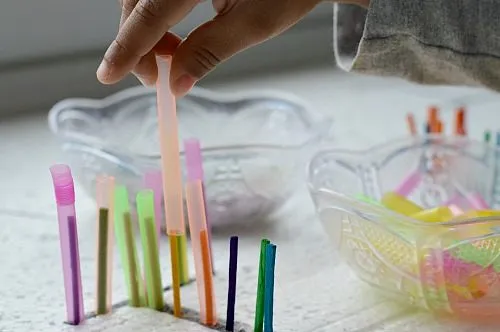 inserting straw over matches