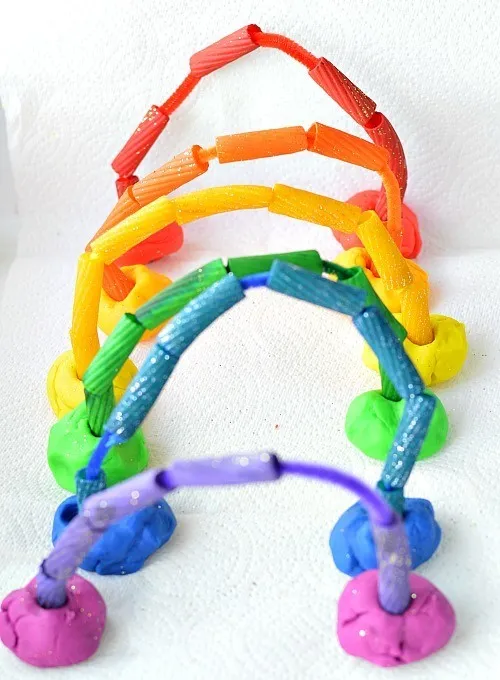 fine motor play rainbow pasta play