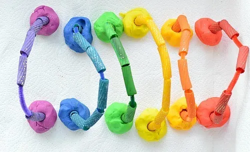 rainbow made with rainbow playdough and pasta