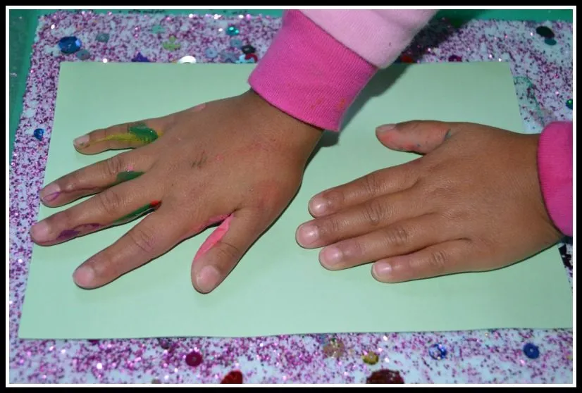 rainbow hand prints with salt glitter as christmas cards