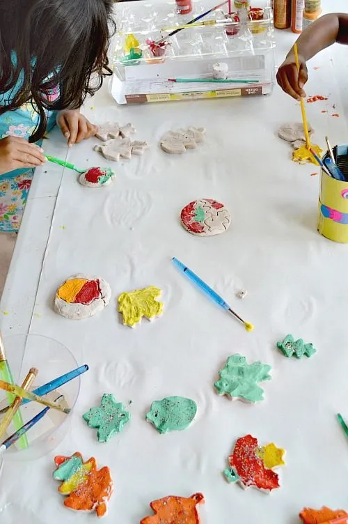 kids painting fall leaves