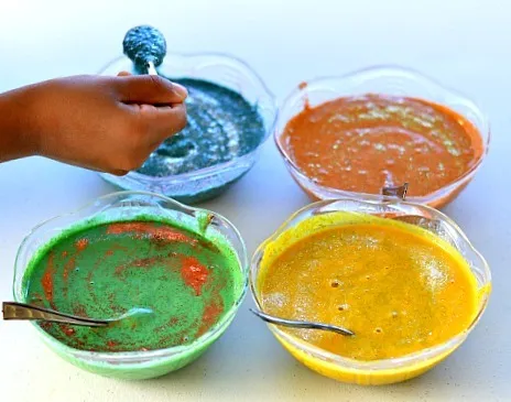 mixing homemade paints for kids