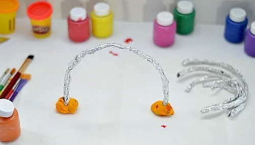 use playdough to keep the foil rainbow up