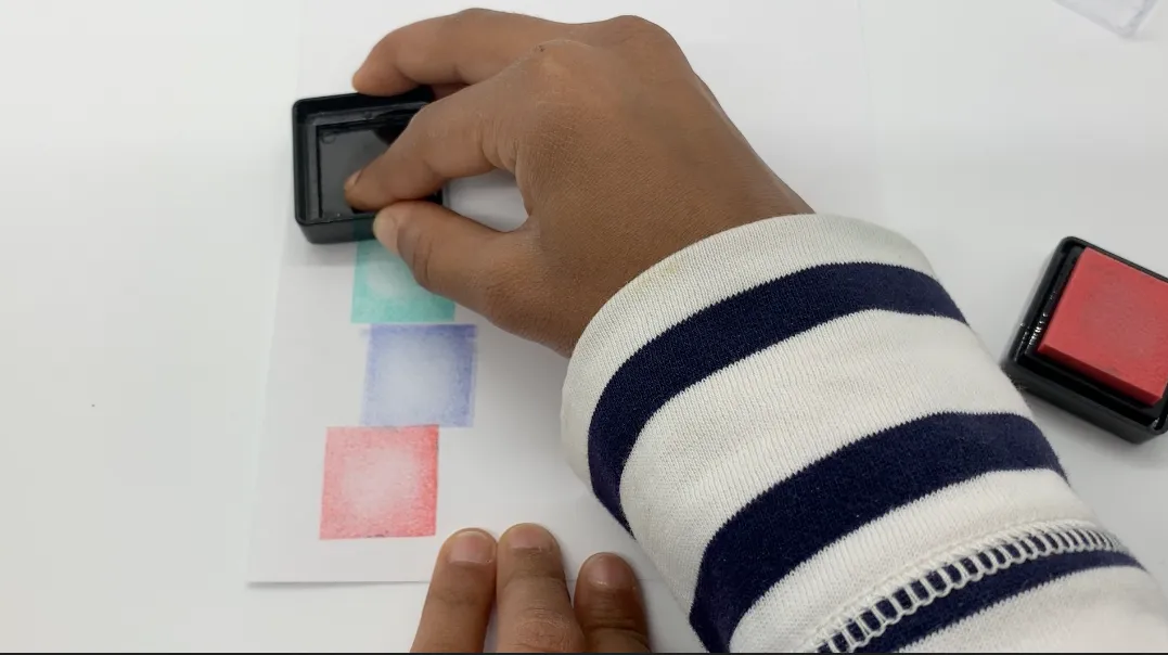 kid stamping a homemade card