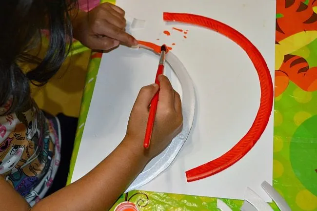 fine motor skills painting rainbows