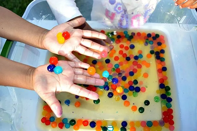 playing in water with boba pearls
