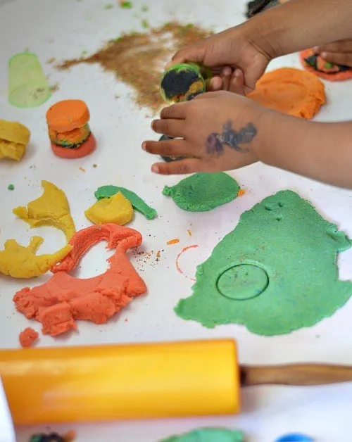 kids playing with sand dough