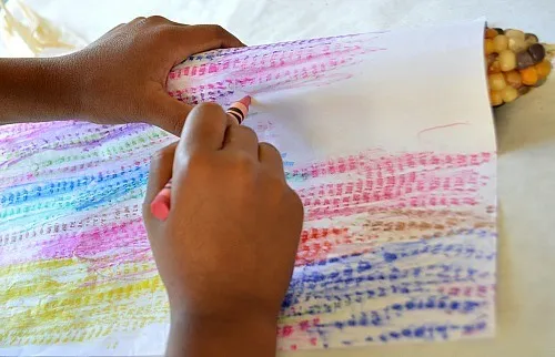 rubbing corn with crayons