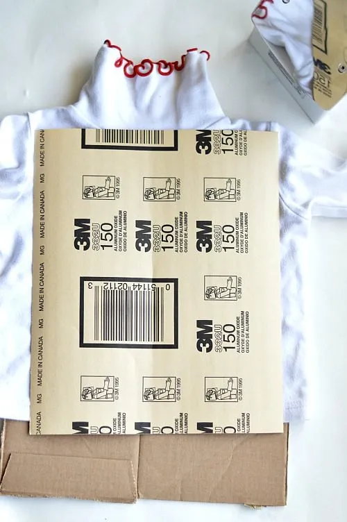 add cardboard to prevent crease