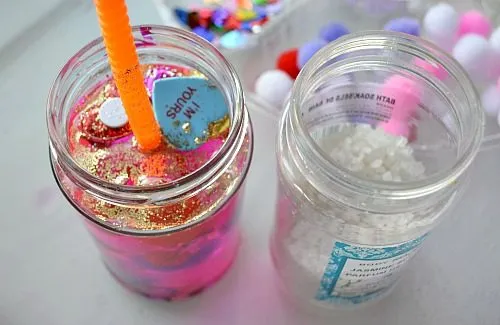 adding bath salts while creating Valentine's day sensory jars