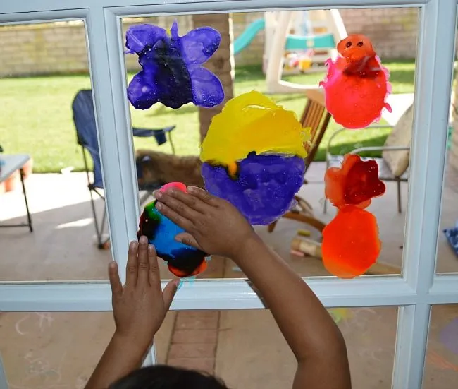 gluing on window clings homemade